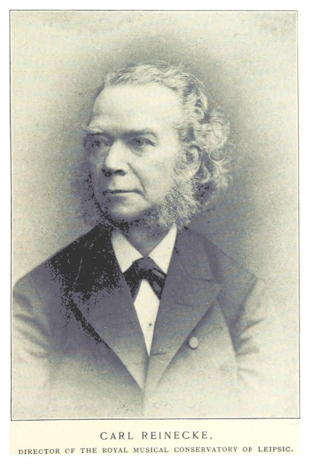 Schwarz-weiß-Porträt von Carl Reinecke, Direktor des Königlichen Musik-Konservatoriums Leipzig, in einem Anzug, mit Text unten.