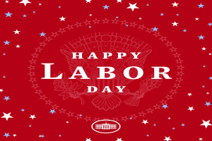 Plakat mit "Happy Labor Day" in fetten weißen Buchstaben auf einem hellroten Hintergrund, umgeben von unterschiedlich großen und farbigen Sternen.